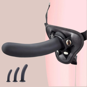 an angled view of The Smooth strap on dildo, you can see it securely fixed into the O Ring and the harness is shown being worn.