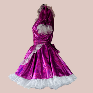 The Tammy metallic fuchsia dress is shown from the side with its apron in place. Our swing style tulle petticoat is showing off the fullness of the skirt to great effect.