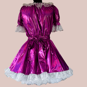 The Tammy metallic fuchsia dress is shown from the back with its apron in place. Our swing style tulle petticoat is showing off the fullness of the skirt to great effect.