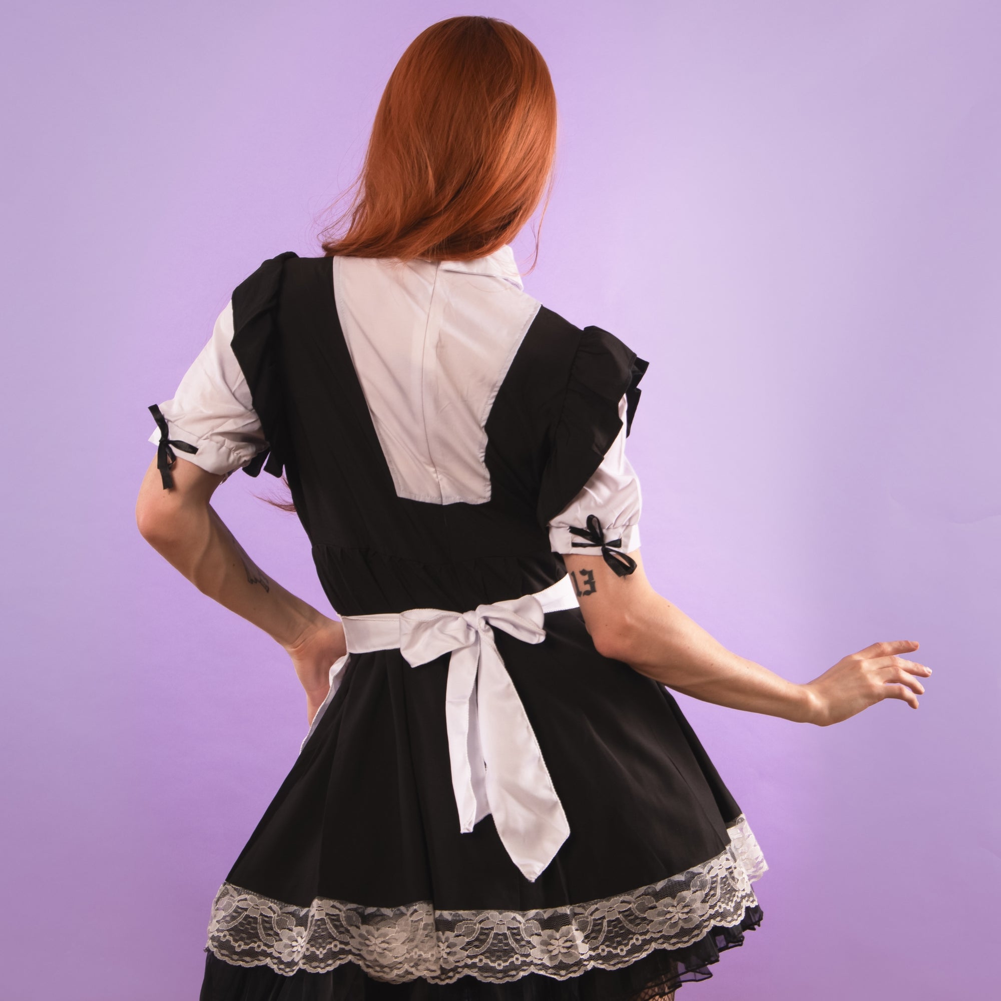 The two tone dress has clever shaping to the back and a fitted zip.