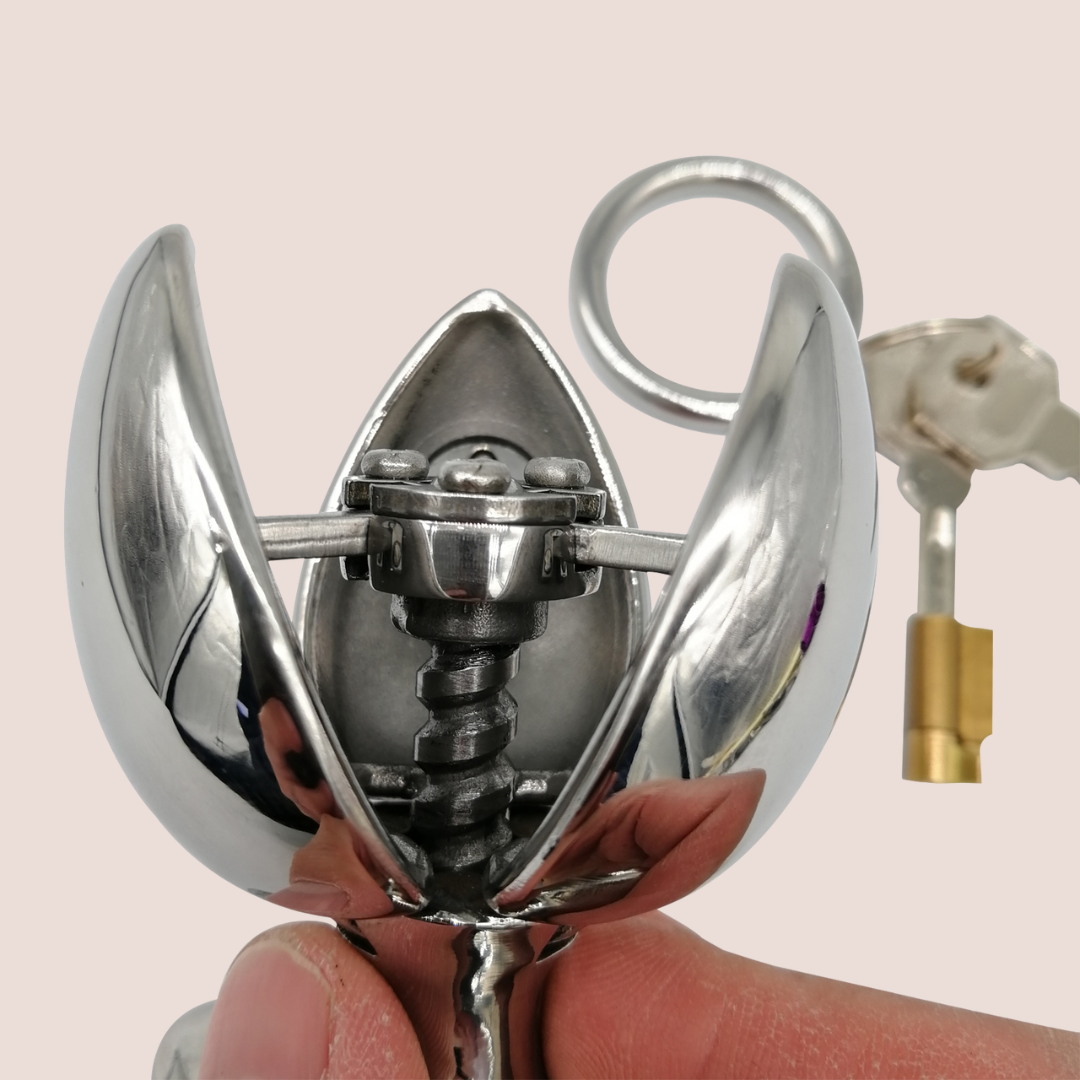 The Blossoming Dilator from House Of Chastity is shown close up, it has been opened to its full extent.