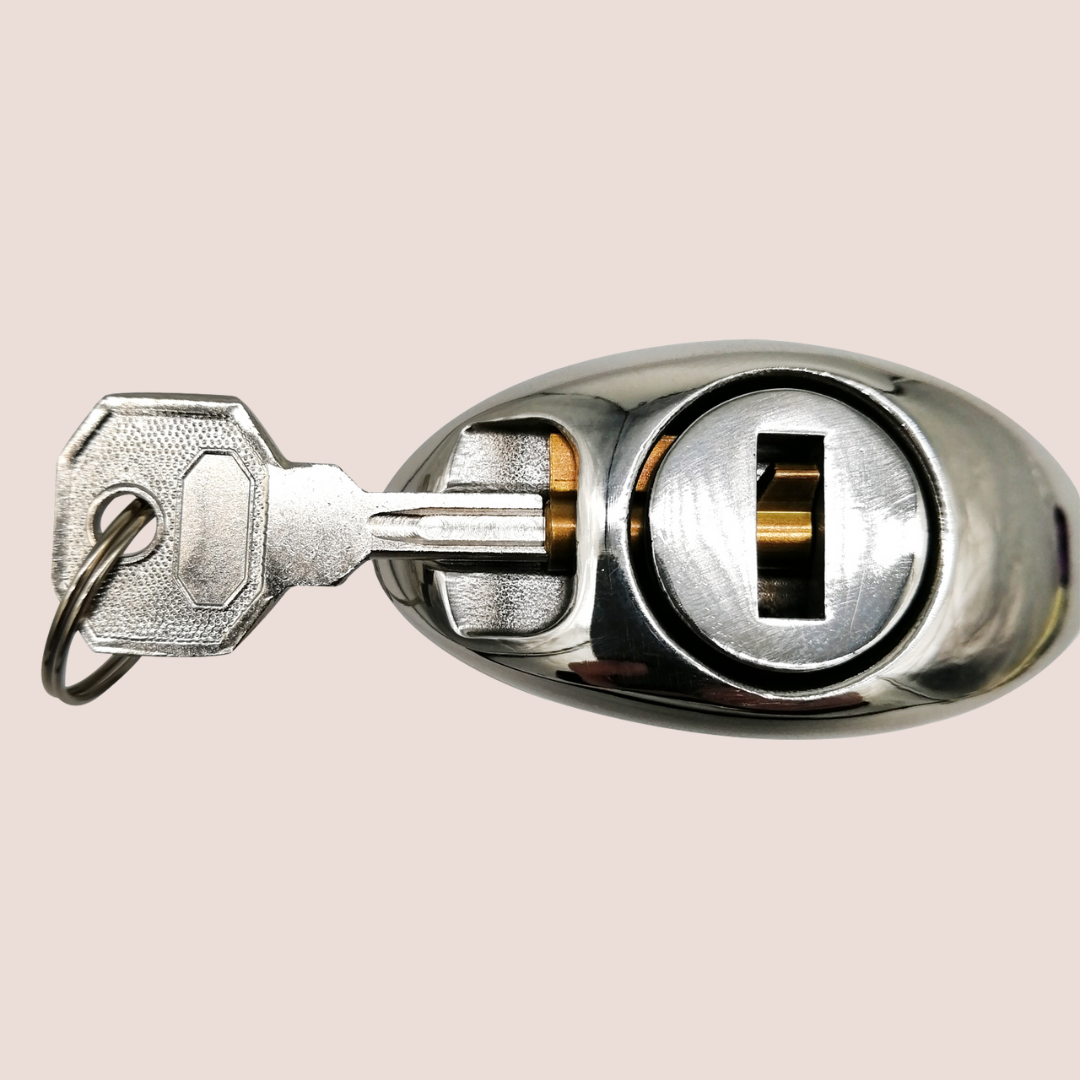 The blossoming dilator from House of Chastity base, you can see the lock being inserted and it shows how the key will lock it in place.