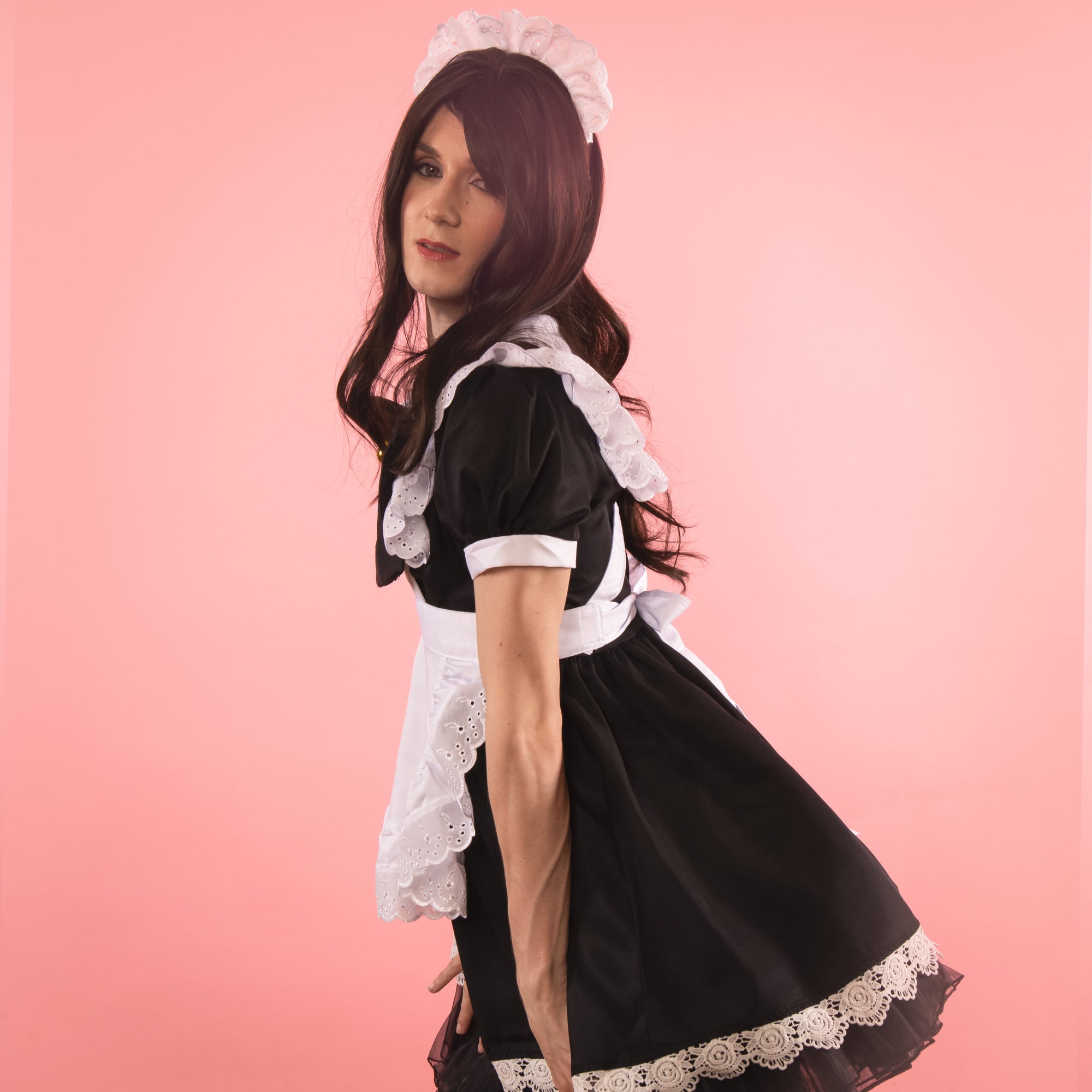 The dress is complemented by the frilly apron.