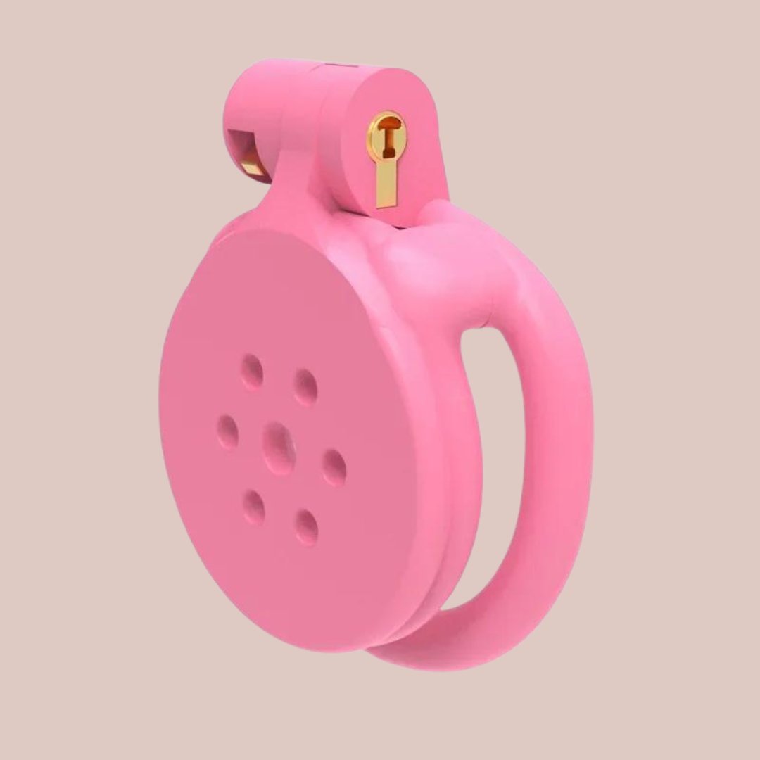 The Flat Gatling Pink with flat rings from House Of Chastity, you can see the chastity cage from a side view with the integral lock fixed in place.