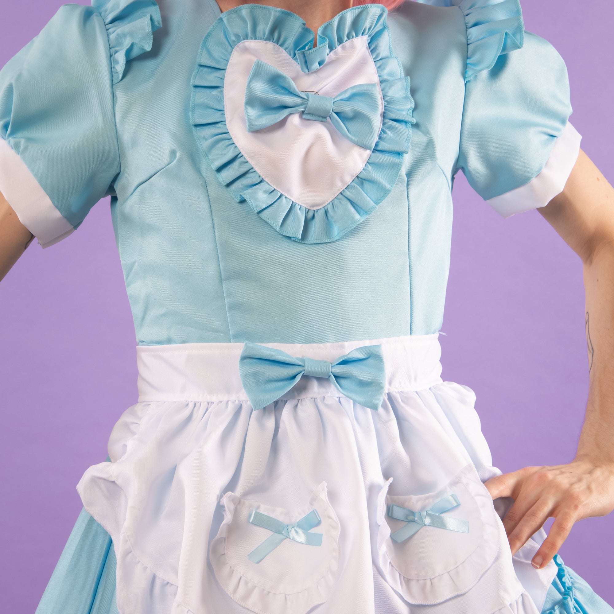 A close up of the heart and bow detailing.