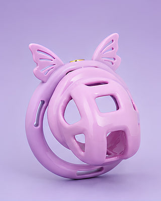 An angled view of the chastity cage, the cage is fitted to the base ring with butterfly ears and the integral lock is fixed in place.