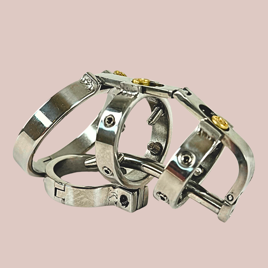 A side view of The Nyx from House Of Chastity, you can see here the base ring, cock ring, urethral tube and barbed adjustable screws to the body.