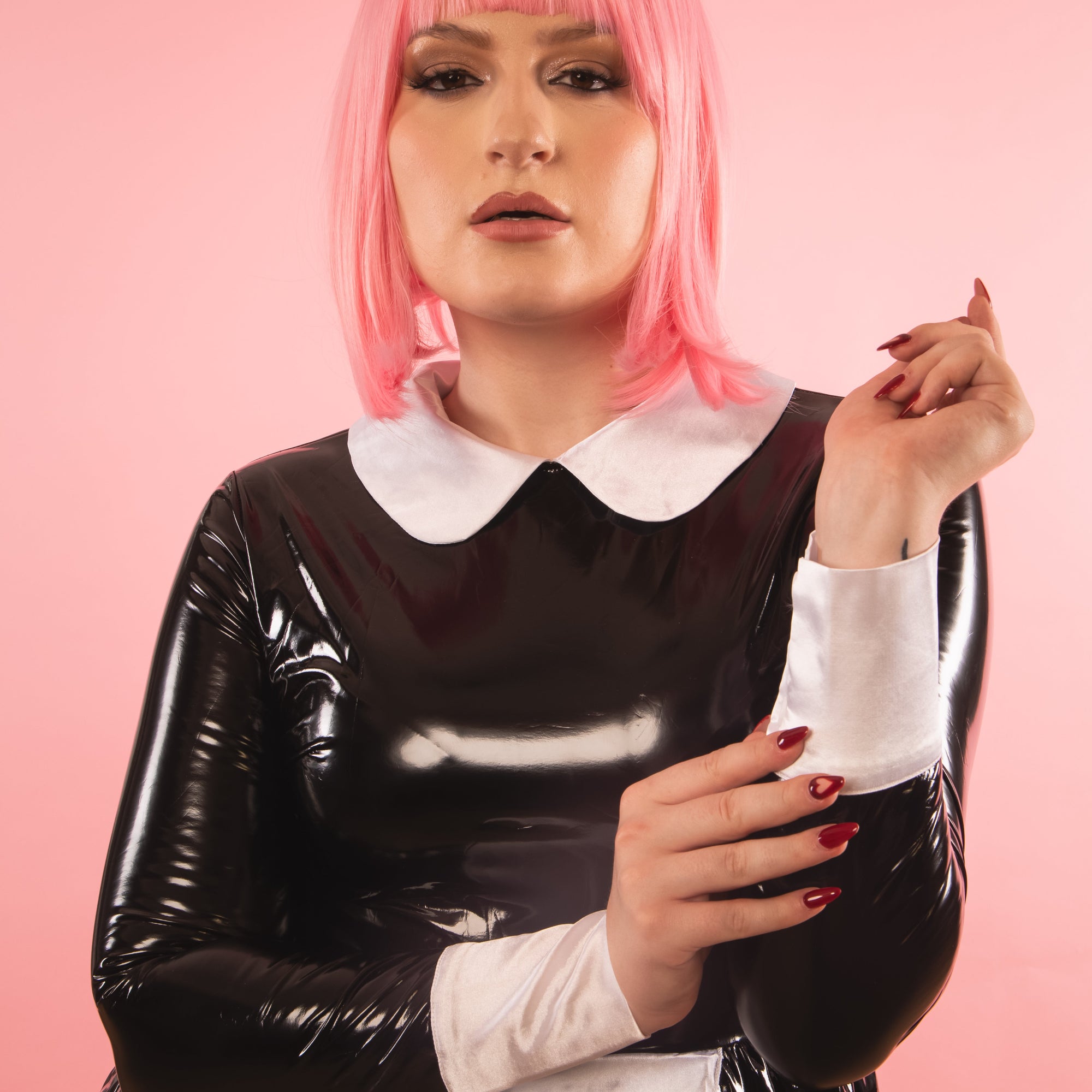 A close up of the white satin collar and cuffs 