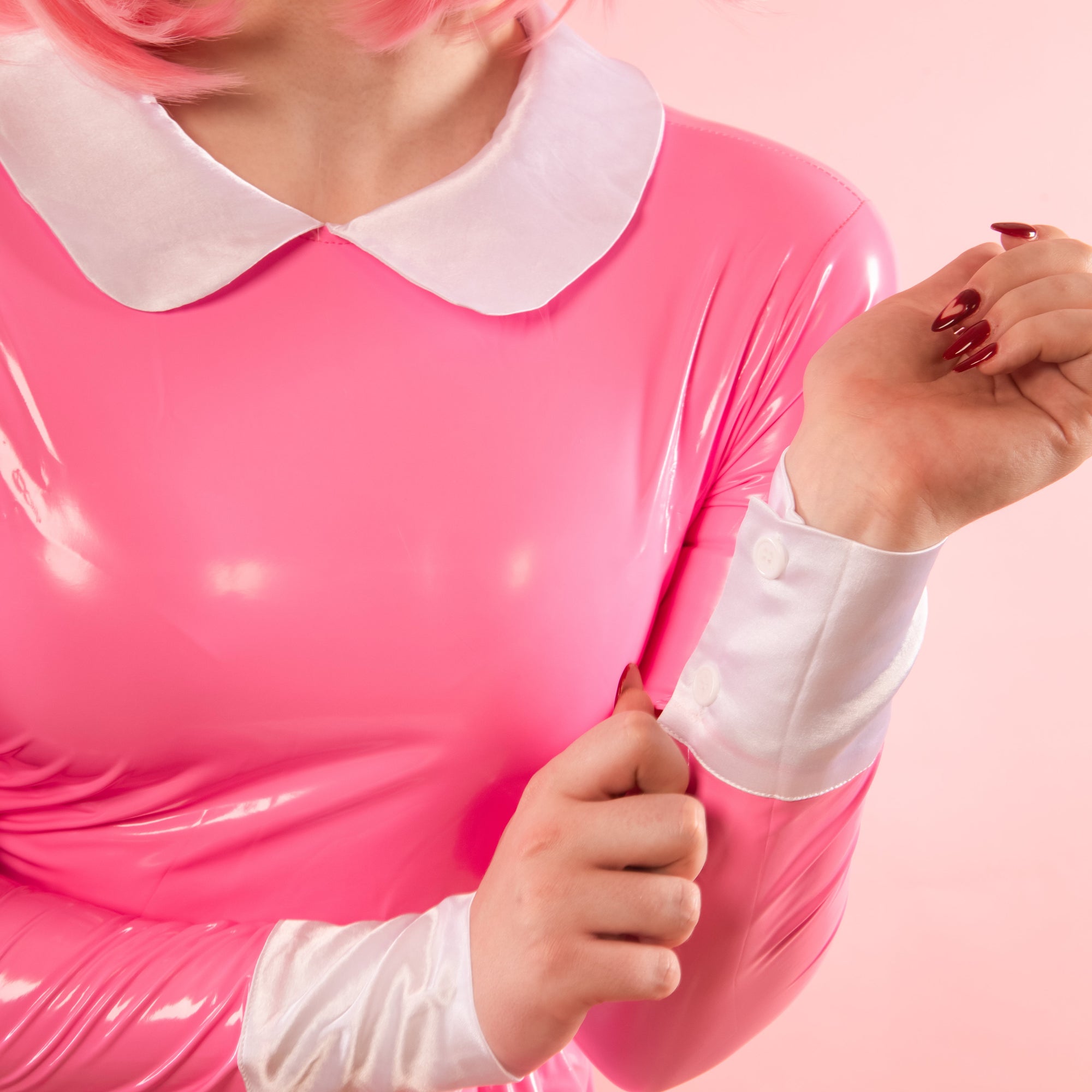 The white satin cuffs have two buttons to allow for easy fitting.