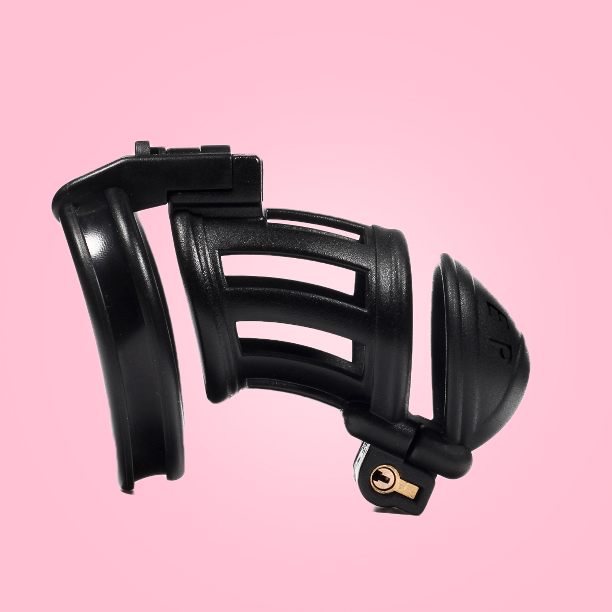 Showing the standard design of the slaver, that comes in 3 different sizes: micro, small and standard double lock cock cages. Made from black resin, with Slaver imprinted on the head.