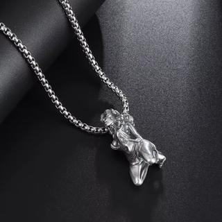 A close up of the silver pendant the figure can be seen clearly in a submissive pose with arms behind its back.