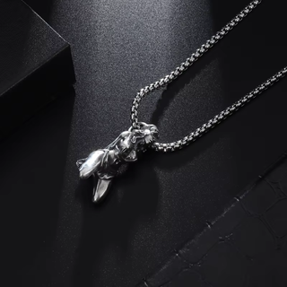 an angled view showing the matching chunky silver chain that the pendant hangs from.