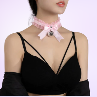 the collar in pink, it is shown on a model in front of a purple background