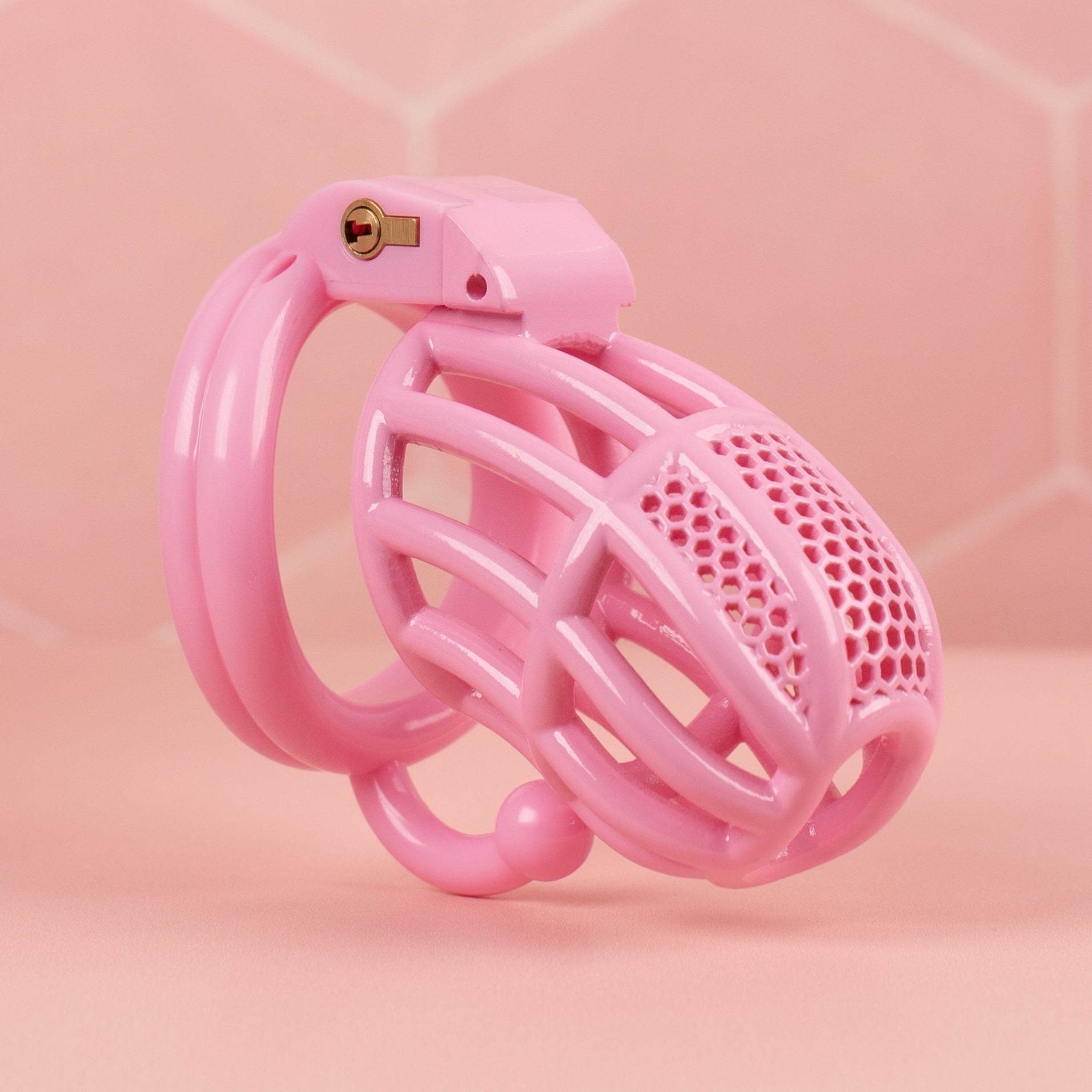 The Detained chastity cage shown here with the ball splitter base ring, this is the pink version of the cage.