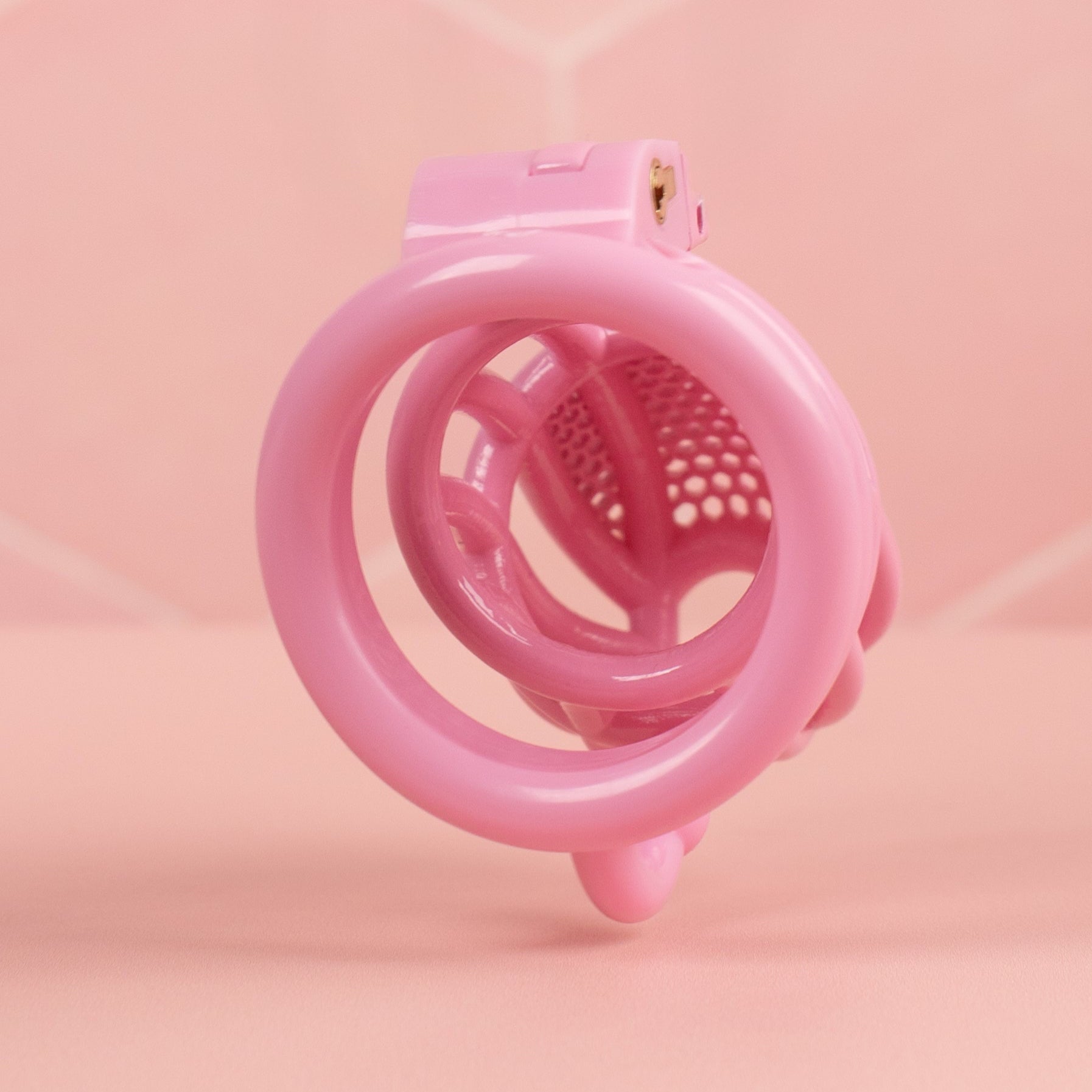 A rear view of the chastity cage, you can see the back of the base ring and the opening to the chastity cage.