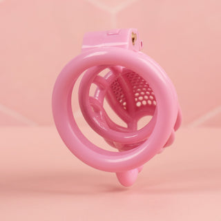A rear view of the chastity cage, you can see the back of the base ring and the opening to the chastity cage.