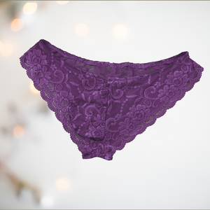 Floral lace panties from House Of Chastity. The knickers are purple, and are in a bikini style with penis pouch.