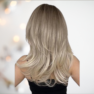 A back view of the HOC1002-2 wig from House of Chastity, you can see the blonde colouring with deep variety of blonde tints, the fashionable layered shaping and the shoulder draping length.