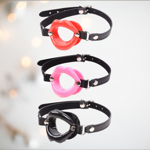 The Luscious Lips mouth gag from House Of Chastity, Shown are the red, pink and black open mouth colour options fitted to the adjustable gag strap.