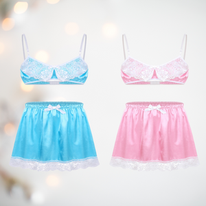 A pretty bra and petticoat set for men, the bra comes in satin baby pink or baby blue with a lace decoration to the cups, thin white bra straps and a matching satin above knee petticoat with white lace edging detail and matching white satin bow detail.