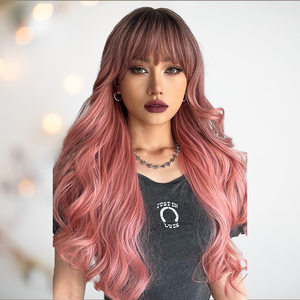 The Pink Ombre long length wig being modelled, you can see how the deep fringe softens the face and the layers and curls create a long flowing look. 