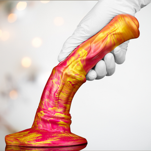 The pink/gold horse dildo from house of chastity, shown is the realistic shape and the base colour, gold variation that makes for a stunning resulting dildo. Also shown is the firmness of the shaft but its ability to bend.
