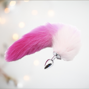 A stainless steel butt plug with a gorgeous pink and white foxtail attached. 