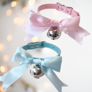 Beautiful bow collars from House of Chastity. Showing our pink and blue collars with satin soft matching ribbons and large silver bell. As shown, they are available in pink and blue.