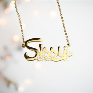 A close up of the gold Sissy necklace with xoxo beneath and hearts at the end.