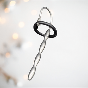 An alternate angle of The long length solid stainless steel urethral sound,shown here with the silicone ring fixed in place,