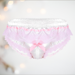A close up of the white satin panties from House Of Chastity. You can see the pretty pink ribbon design, pink lace edging with a pink bow detail attached to the zipper that runs from front to back. 